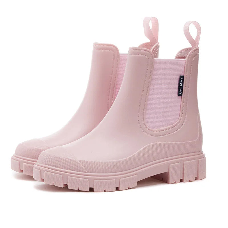 Women's black Chelsea-style waterproof rain boots with elastic side panels for easy slip-on wear