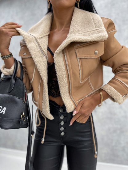 Women's cropped faux leather jacket with shearling lining, slim fit zip closure, edgy chic style