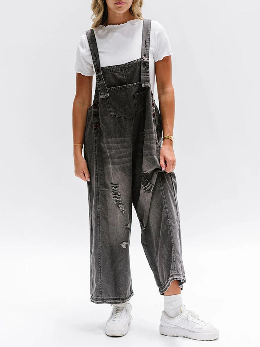 Hazel washed denim overalls women relaxed wide-leg silhouette with raw-edge distressing and adjustable straps