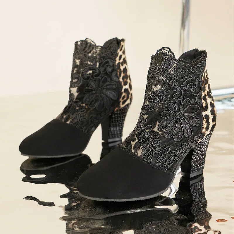 Elegant black lace mesh high heel boots with sleek silhouette and leg-lengthening stiletto design