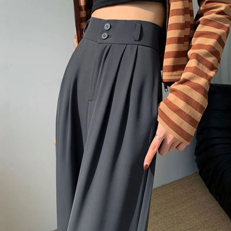 Black high-waist palazzo trousers with wide-leg drape and streamlined silhouette for women