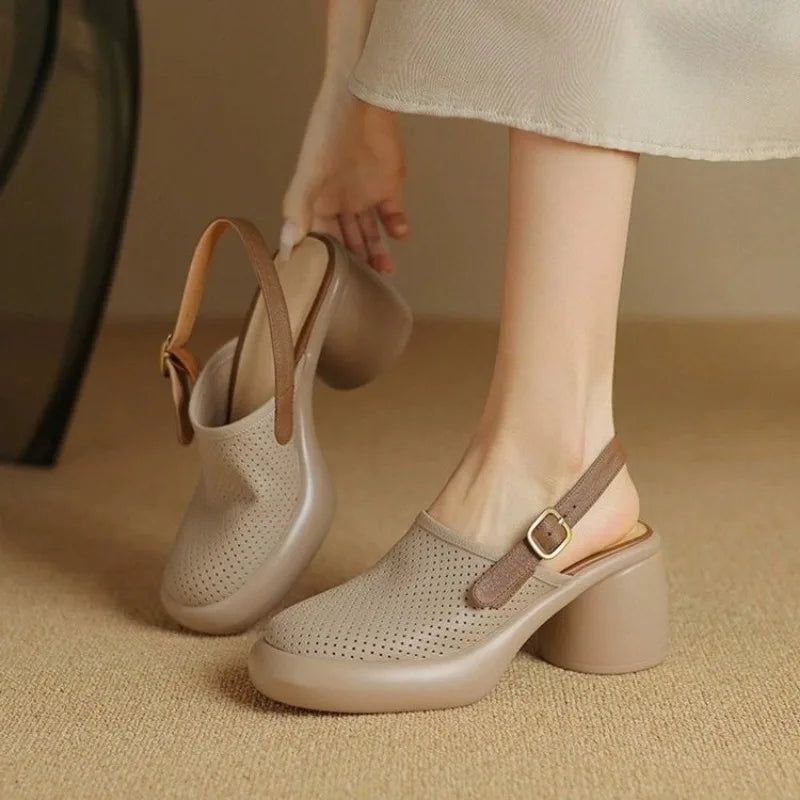 Women's low heel flat sandals with sculpted hollow heel detail in sleek minimalist silhouette