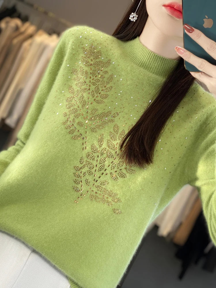Ivory embellished sweater with delicate details, flattering silhouette, and effortless everyday glamour