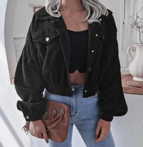 Corduroy cropped jacket in warm neutral tone with structured silhouette and plush textured finish
