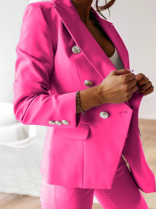 Navy double-breasted blazer set with slim high-waist pants, gold buttons, structured women's suit