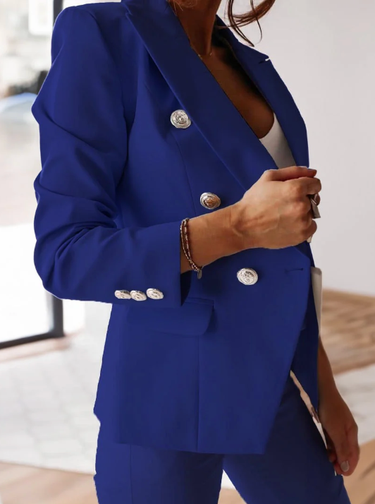 Navy double-breasted blazer set with slim high-waist pants, gold buttons, structured fit