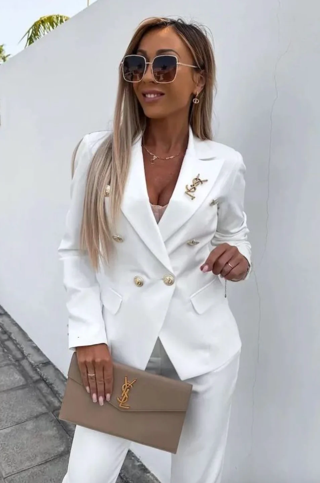 Navy double-breasted blazer set with slim high-waist pants, gold buttons, structured fit