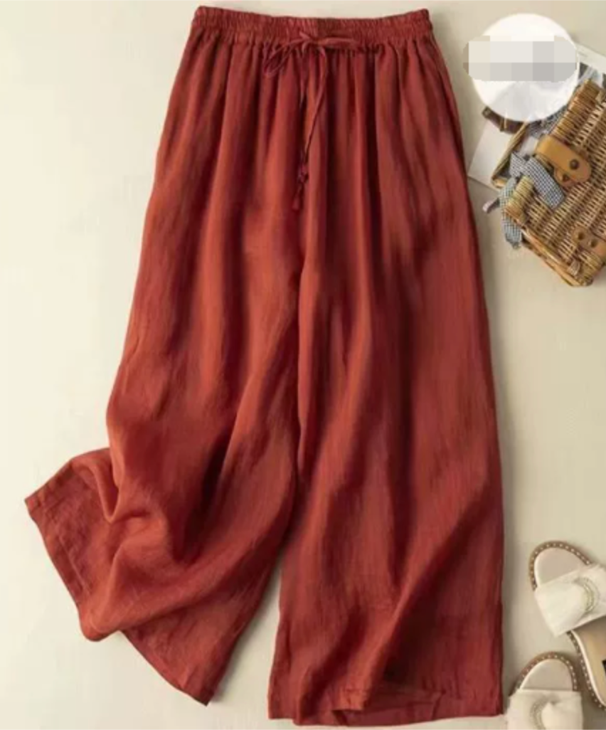 Sandra relaxed wide-leg pants in soft neutral tone with gathered waistband and flowing silhouette