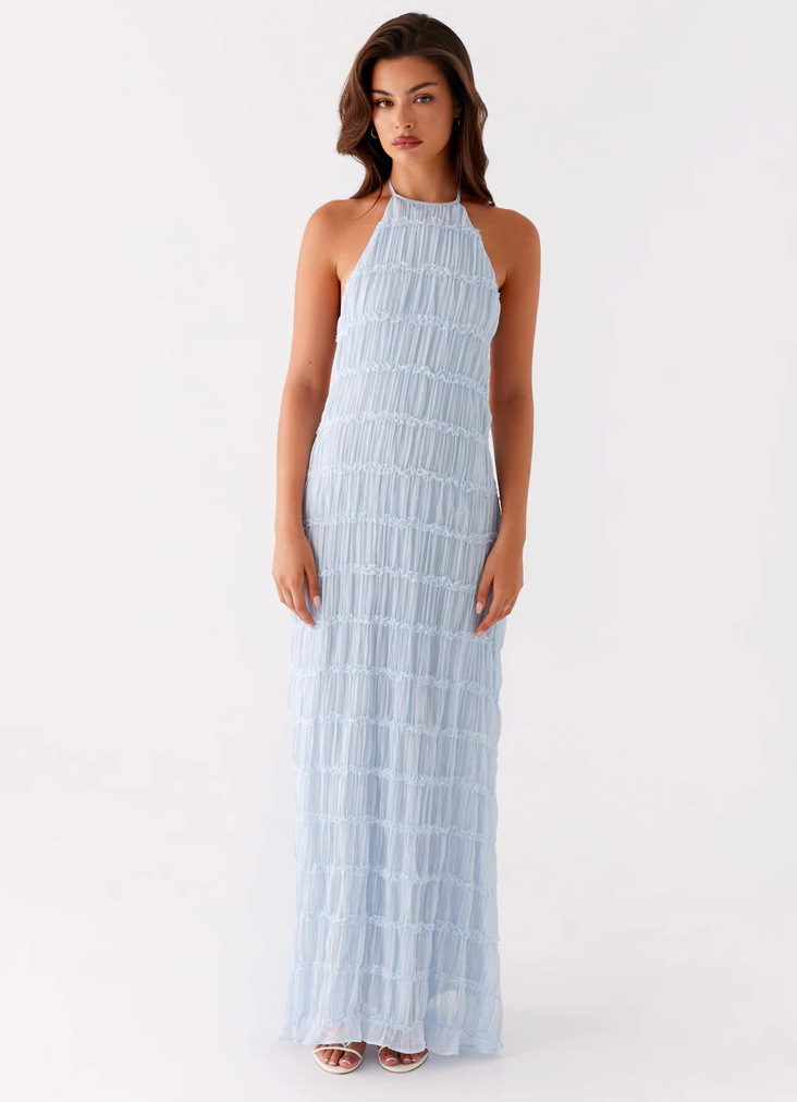 Elegant halter maxi dress in flowing fabric with sculpting silhouette and graceful skirt