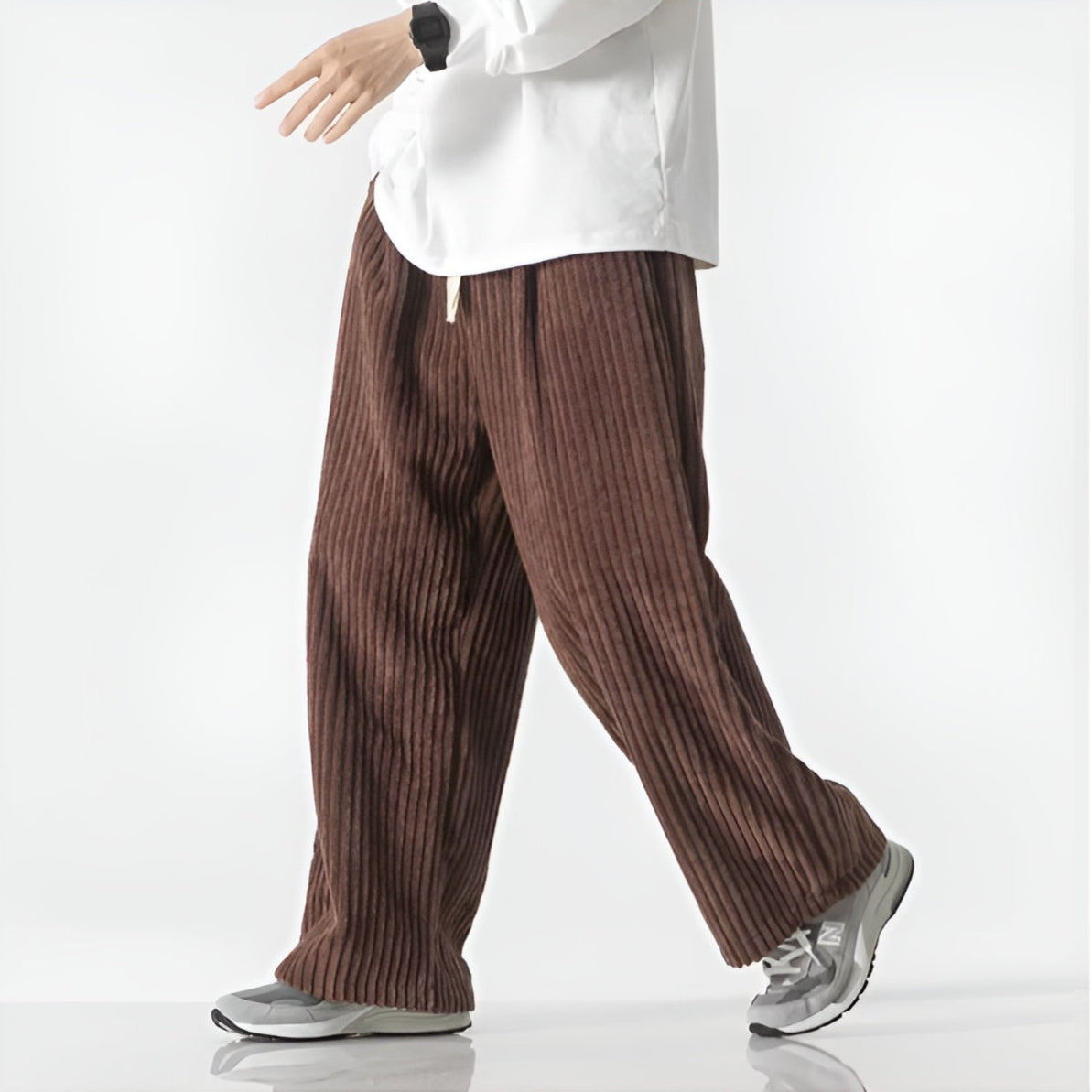 Relaxed corduroy pants in neutral tone with densely ribbed texture and elastic drawstring waist