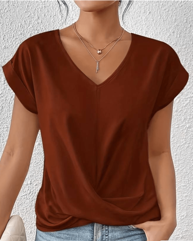 Women's jade green V-neck twist front top with gathered hem detail and cuffed cap sleeves