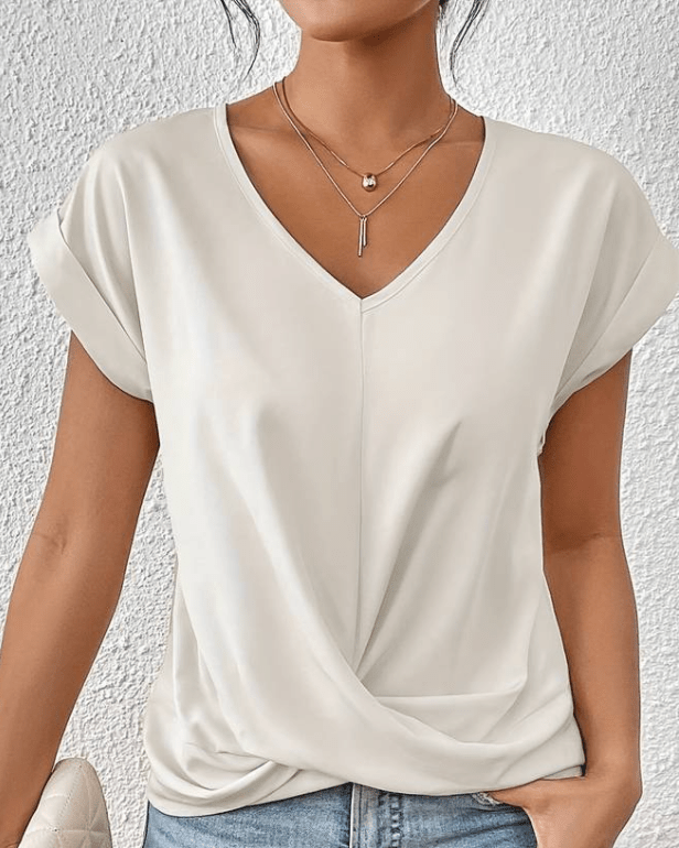 Women's jade green V-neck twist front top with gathered hem detail and cuffed cap sleeves