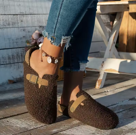 Cozy slip-on sherpa lounge slippers with plush lining, buckle accent, and platform sole