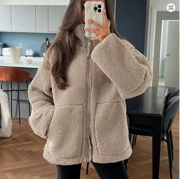 Unisex sherpa fleece zip-up jacket in cozy texture with high collar and hip-length cut