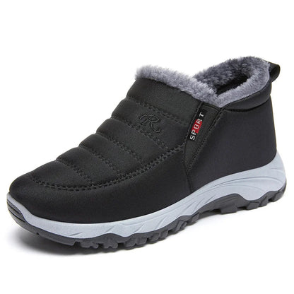 Women's quilted waterproof slip-on ankle boots with faux fur lining and elastic panels