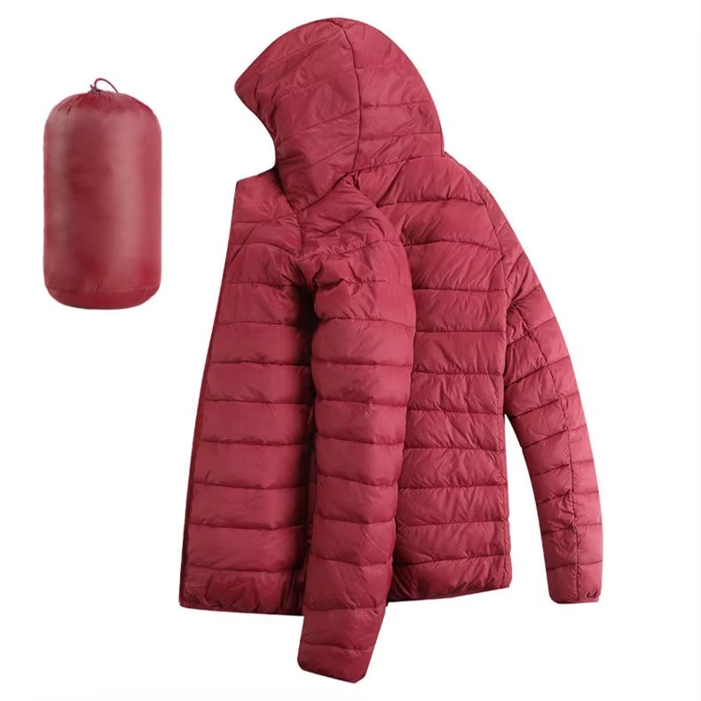 Men's lightweight hooded down jacket in neutral tone with zip pockets, slim city-ready fit