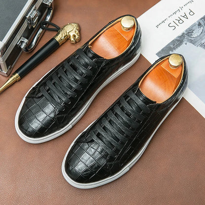 White low-top sneaker with embossed alligator synthetic leather upper and cushioned rubber outsole