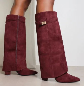 Black women's leather thigh-high boots with silver buckle detail, sleek fitted silhouette