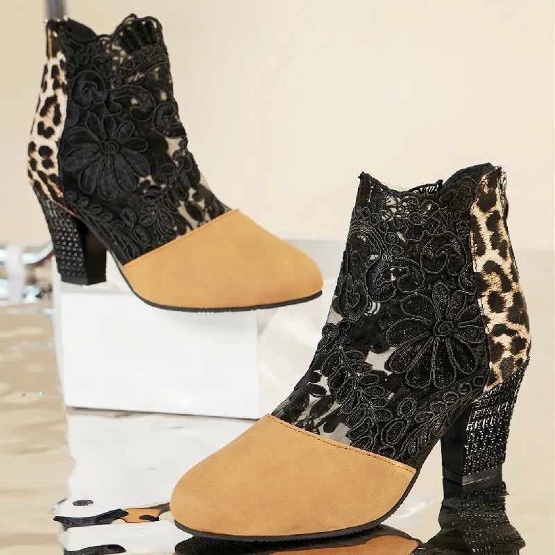 Elegant black lace mesh high heel boots with sleek silhouette and leg-lengthening stiletto design