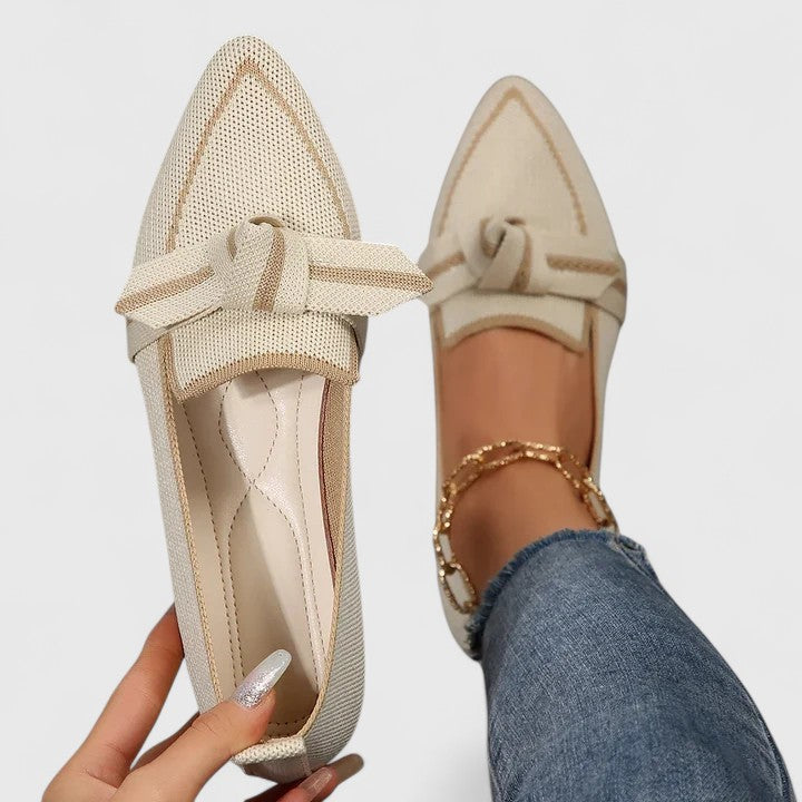 Women's pointed toe slip-on flat loafers in two-tone colorway with elegant knot detail