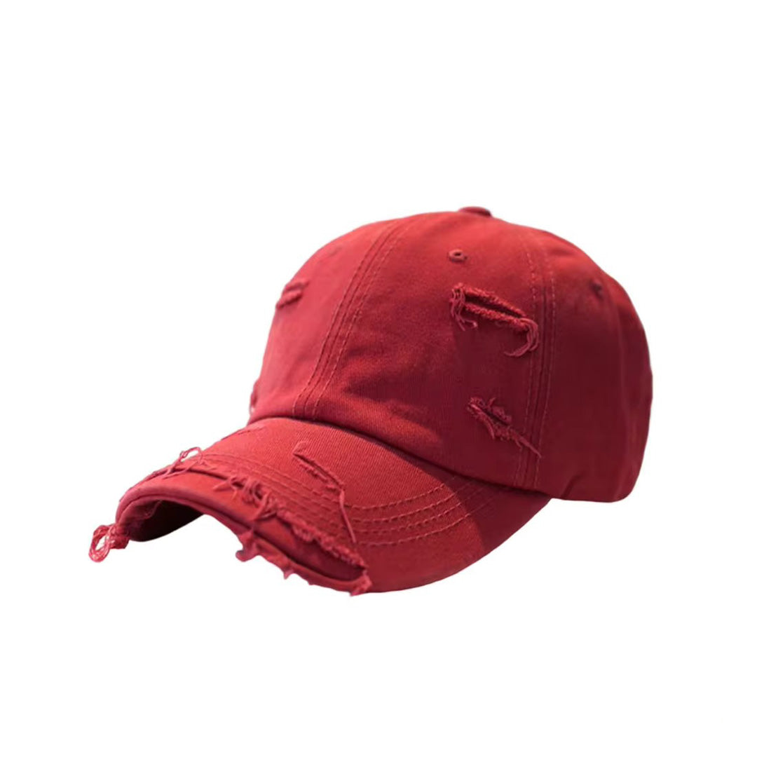 Vintage distressed cotton baseball hat with extended brim and ripped detailing in multiple colors