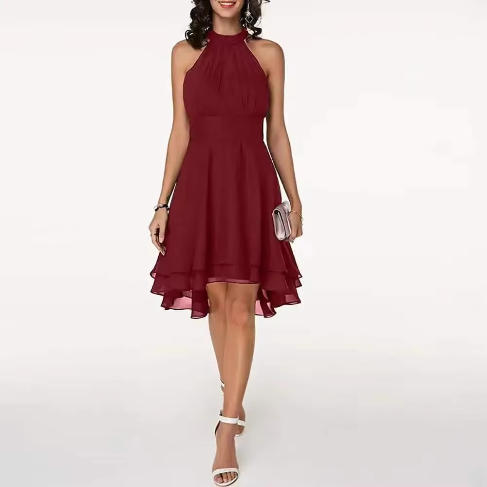 Women's halter neck sleeveless summer dress with elegant ruffle hem in flowing silhouette