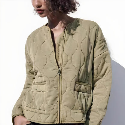 Black quilted bomber jacket with padded insulation, zipper closure, and tailored fit