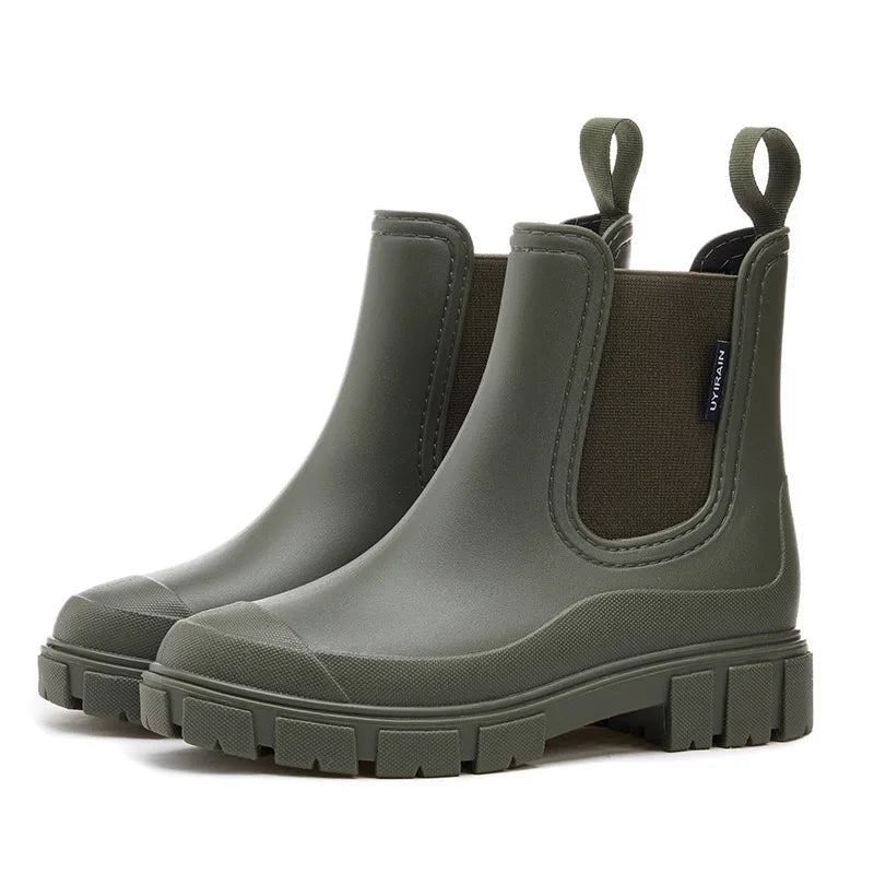 Women's black Chelsea-style rain boots with waterproof construction and elastic side panels