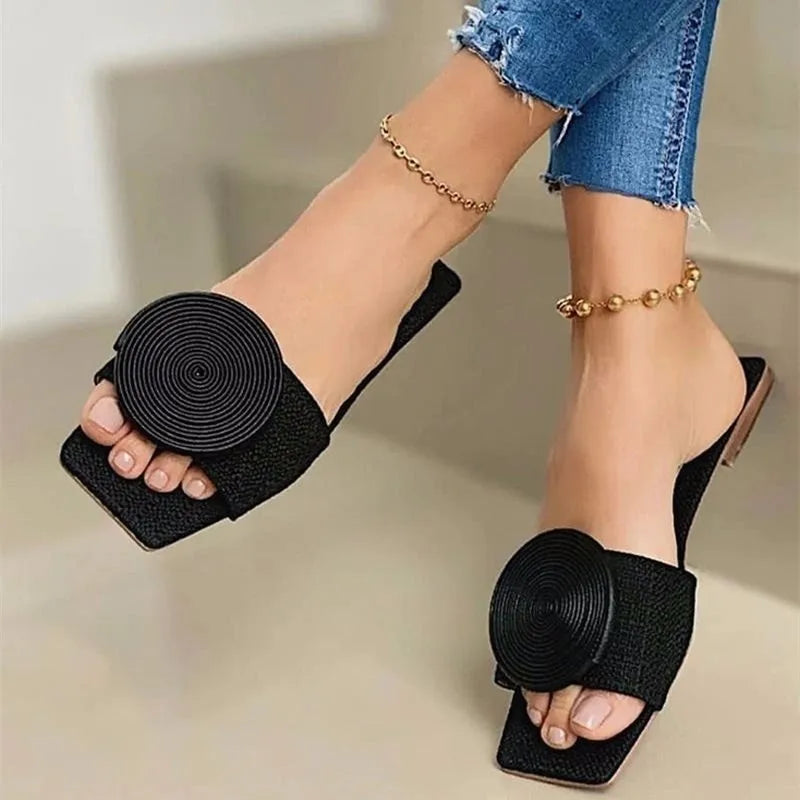 Women's woven sandals with intricate thread detailing, elegant and supportive everyday style