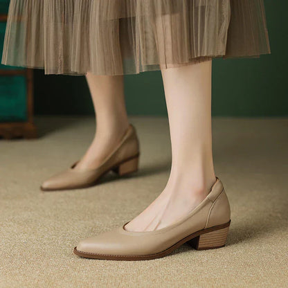 Women's pointed toe block heel pumps in classic slip-on style with stable mid-height heel for all-day wear