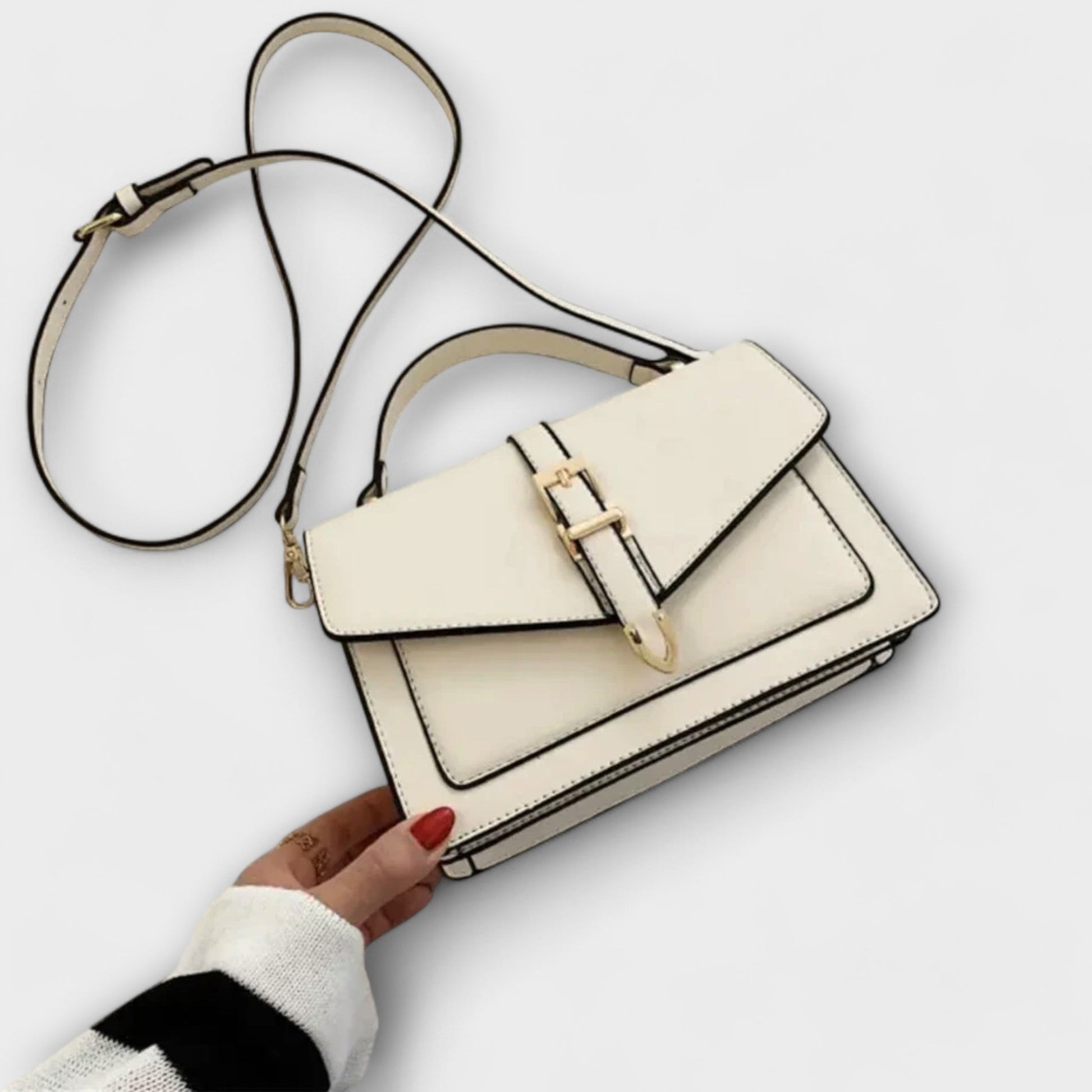 Classic beige structured shoulder bag with elegant gold buckle detail, compact and versatile everyday style