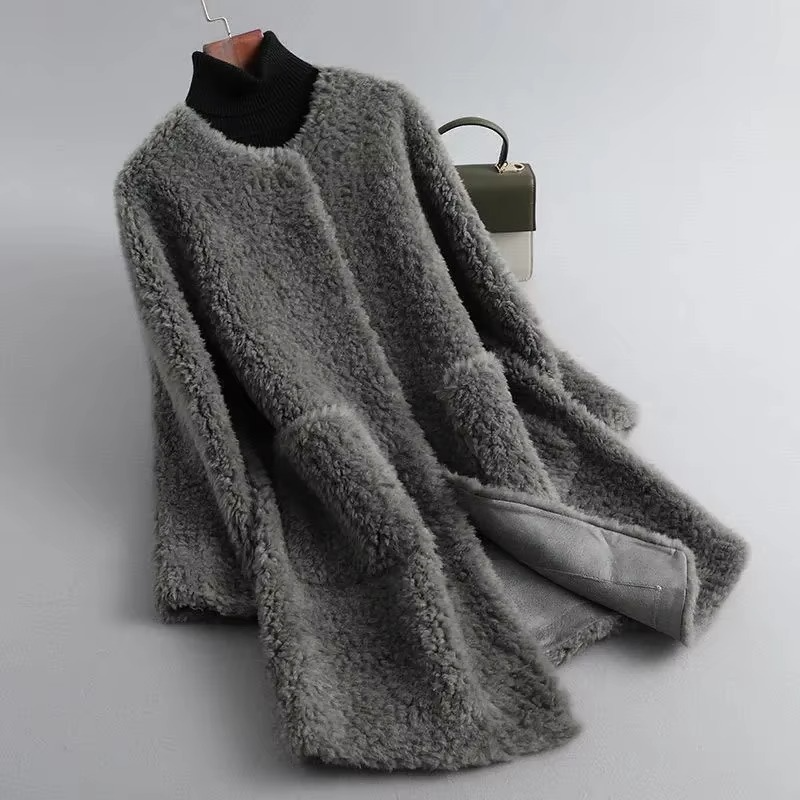 Women's mid-length plush faux lamb fur coat in neutral tone with cozy cardigan-style silhouette