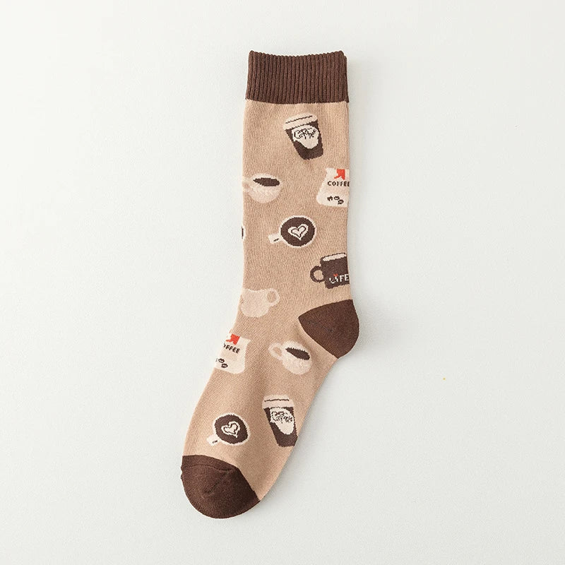 Cozy white crew socks with playful coffee cup print, perfect quirky accessory for caffeine lovers