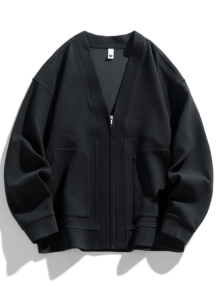 Oversized zip-front textured cotton cardigan in relaxed fit with subtle depth and draped shoulders