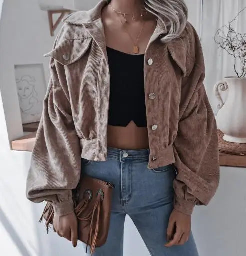 Cropped corduroy short jacket in warm autumn tones with plush polyester texture and structured silhouette