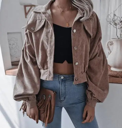 Cropped corduroy short jacket in warm autumn tones with plush polyester texture and structured silhouette