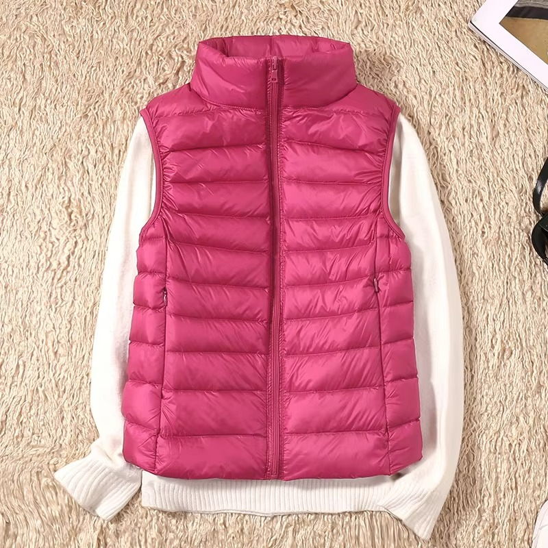 Women's cropped sleeveless light down puffer vest in neutral tone, slim-fit quilted insulation