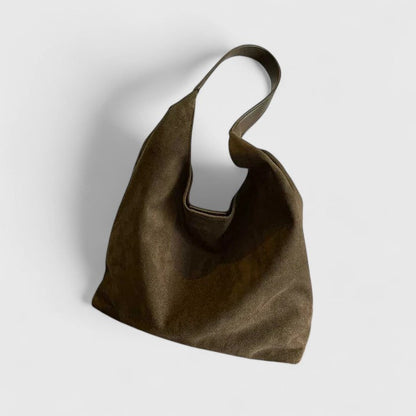 Minimalist black shoulder bag with clean lines, structured silhouette, and sleek top handle strap