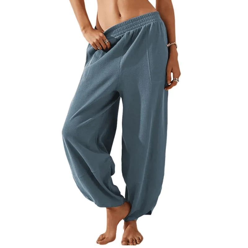 Sophia wide-leg trousers in neutral tone, relaxed fit with elastic waistband for effortless spring style