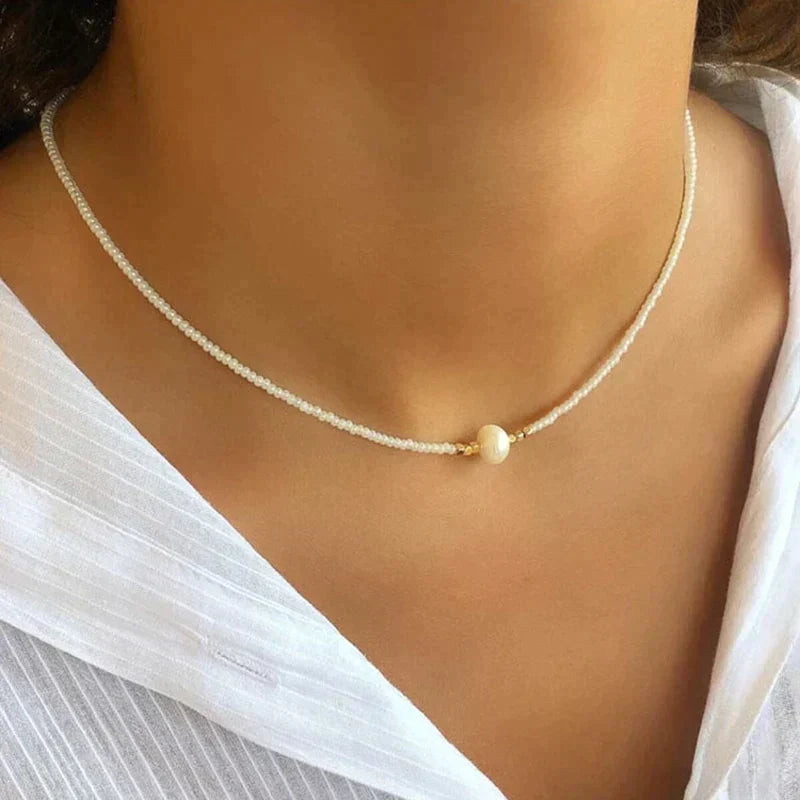 Minimalist pearl beaded choker necklace with faux pearl centerpiece, snug choker-length silhouette