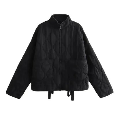 Black quilted bomber jacket with padded insulation, zipper closure, and tailored flattering fit