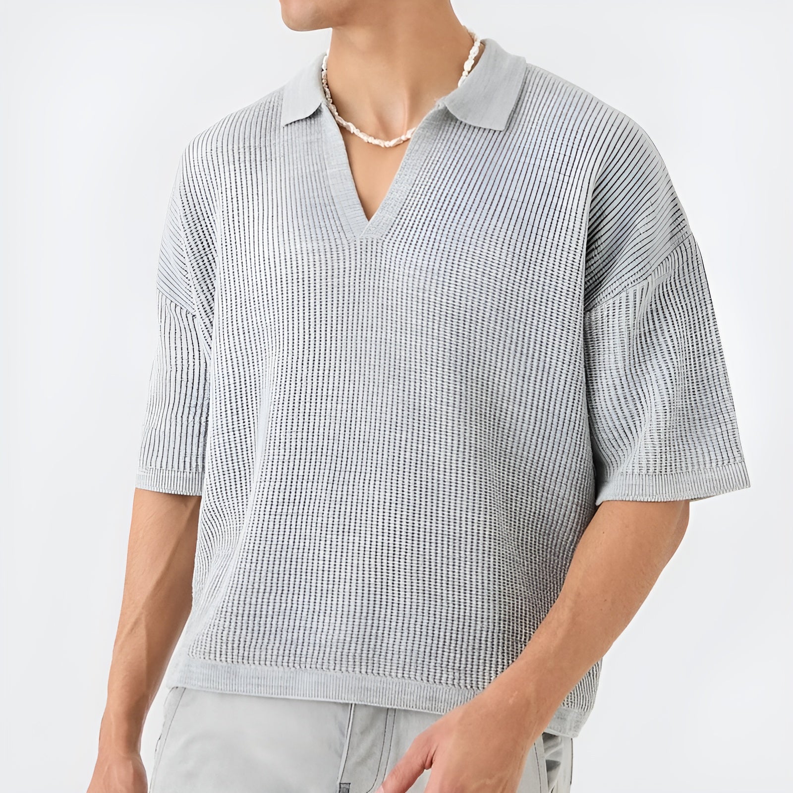 Ivory oversized boxy knit polo shirt with honeycomb texture, V-neck flat collar, and short sleeves