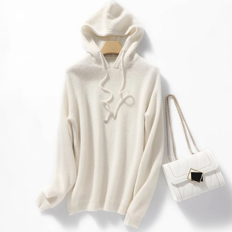 Cream ribbed wool-blend relaxed hoodie with long drawstrings and softly textured knit fabric