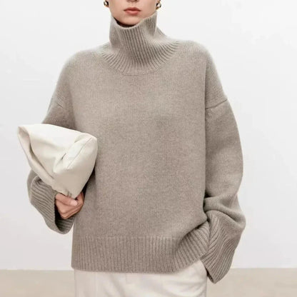 Ivory oversized cashmere high-neck sweater with relaxed silhouette and plush wool-blend texture