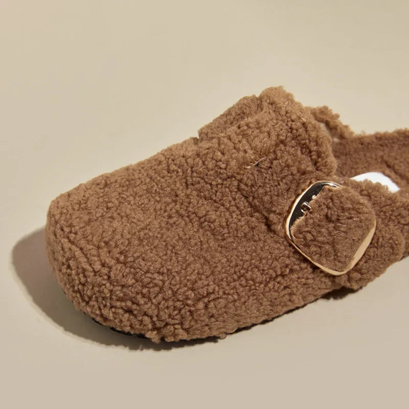 Women's plush lamb wool mule slippers in alpine style with adjustable buckle closure