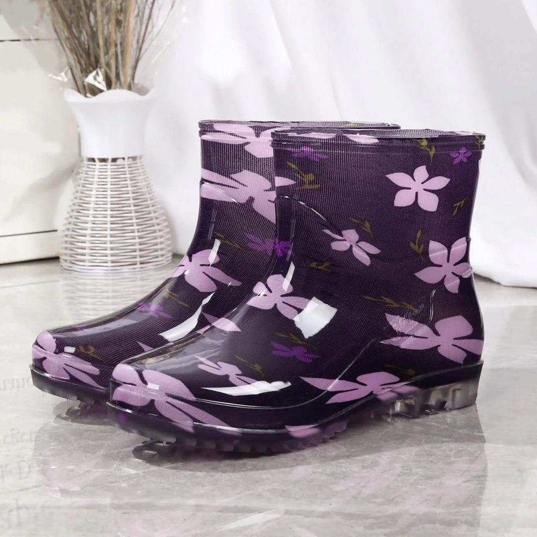 Women's waterproof rubber Wellington boots slip-on mid-calf style with outdoor grip sole for rainy days
