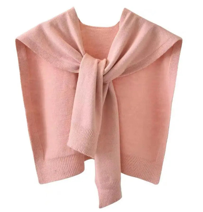 Chunky knitted scarf wrap in neutral tone, rectangular silhouette with sweater-inspired texture