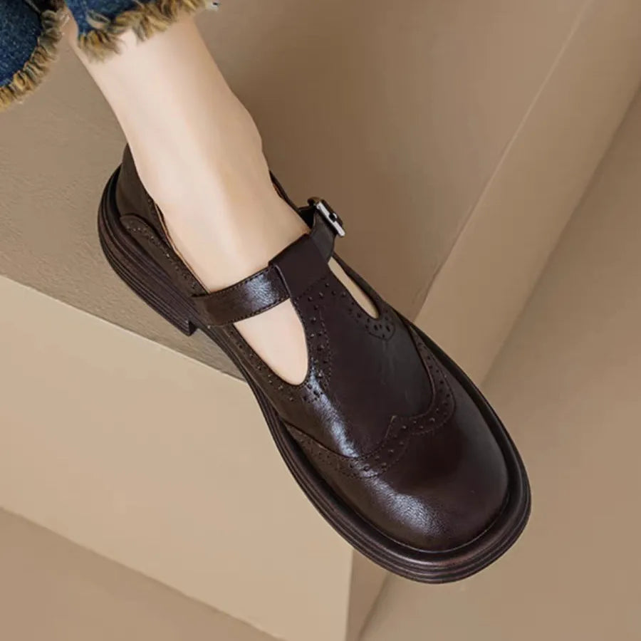Women's classic leather T-strap shoes in neutral tone with vintage-inspired silhouette and full-grain upper