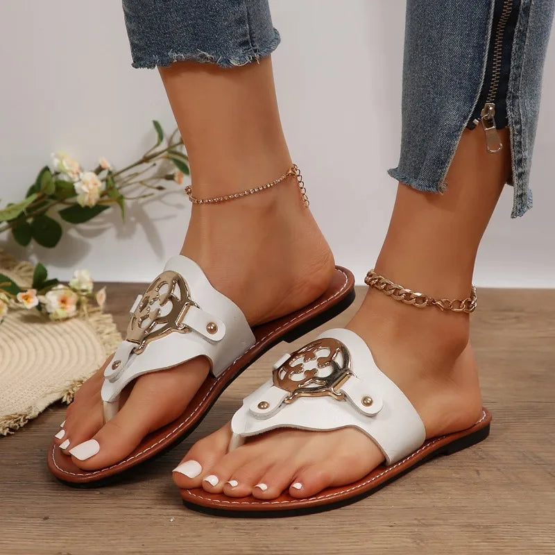 Women's beige open-toe flat sandals with minimalist straps, effortless summer style for all-day wear