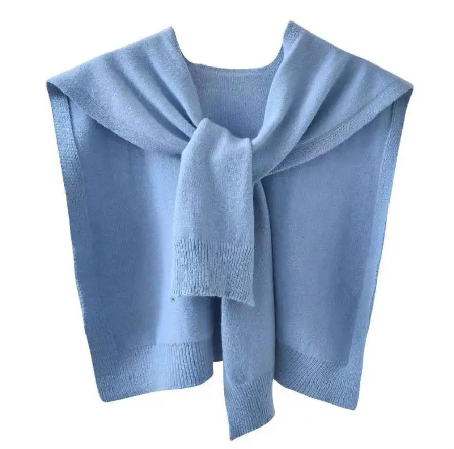 Chunky knitted scarf wrap in neutral tone, rectangular silhouette with sweater-inspired texture